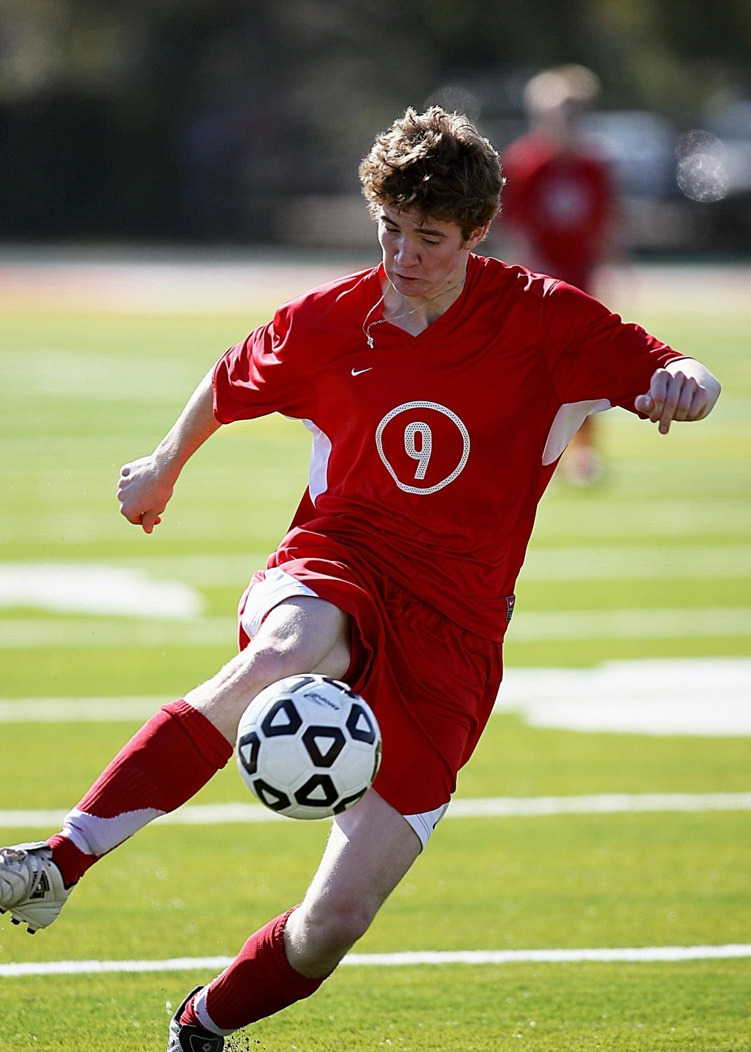 Young athlete playing soccer in a youth tournament
